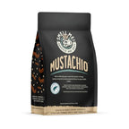 Bones Coffee Company Mustachio Flavored Ground Coffee Beans Pistachio Flavor | 12 oz Flavored Coffee Gifts | Low Acid Medium Roast Gourmet Coffee Beverages (Ground)
