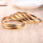 Castillna 14K Plated Gold Bangle Bracelets for Women, Set of 7 Pieces, 9 Inches