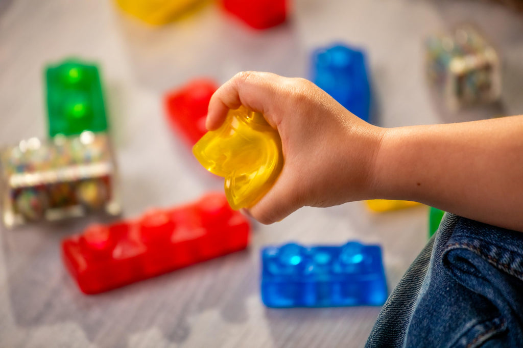 Jelly Blox Stash 'N Stack 2-in-1 Storage Case Including 30 Blocks | Toddler & Preschool Building Blocks Kids Can Squeeze & Stretch | Safety Tested & Ouch-Free | Tactile, Sensory Play Toy for Ages 2+