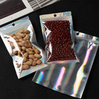 EgticLive 100 Pack Resealable Holographic Bags for Small Business, Iridescent Mylar Bags with Clear Front Smell Proof Foil Packing Pouches for Multipurpose Storage (6.3 X 9.5 inches)