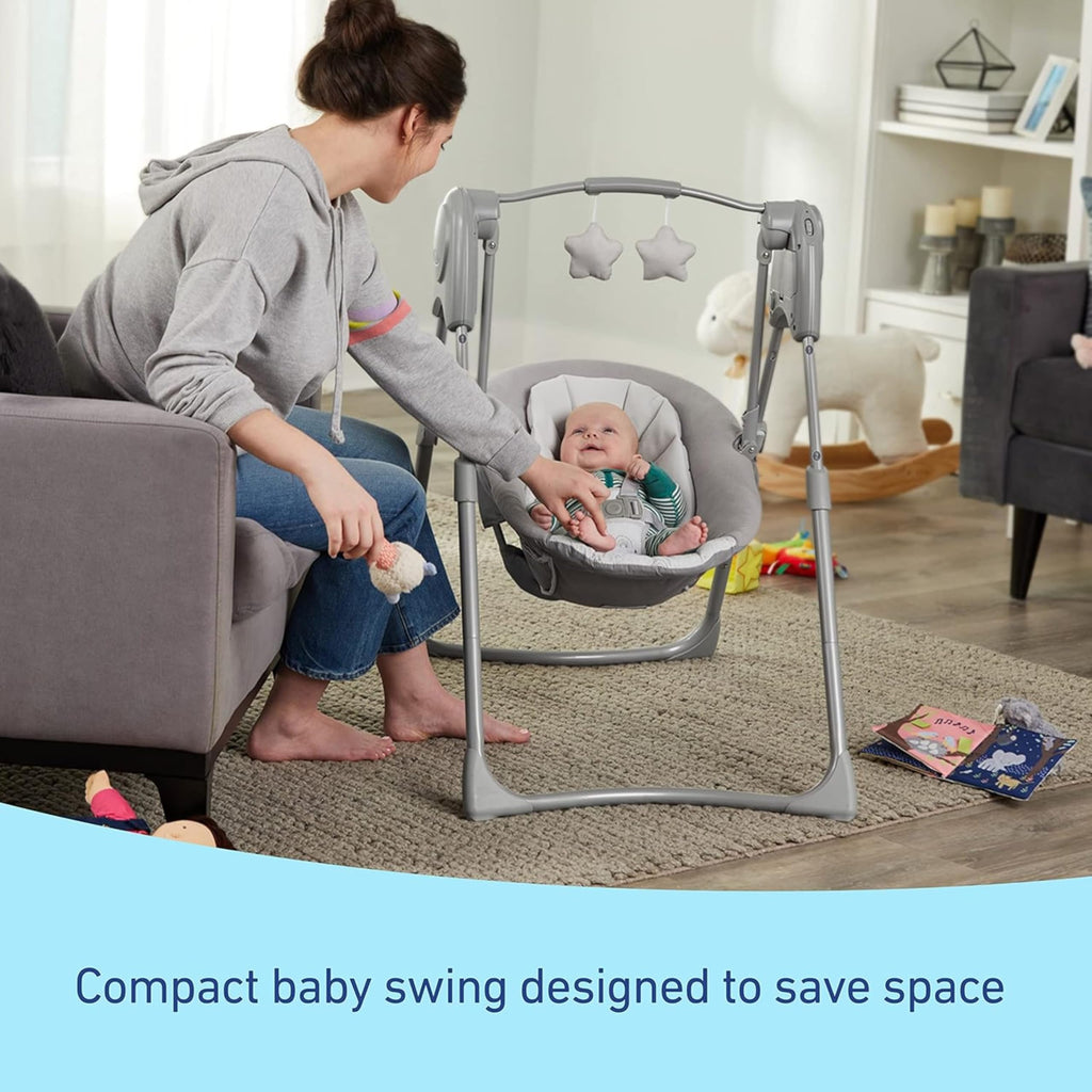Graco Slim Spaces Compact Baby Swing, Space Saving Portable Bay Swing with Height Adjustable Legs & Soft Toys, Reign