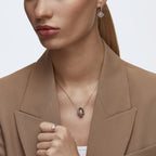 Swarovski Una Pierced Earrings with Clear Crystal Pavé Surrounding a Pink Stone on a Rose-Gold Tone Finished Setting